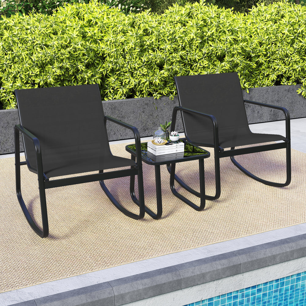 Two black rocking bistro chairs with a glass-top table, perfect for poolside relaxation or balcony use.
