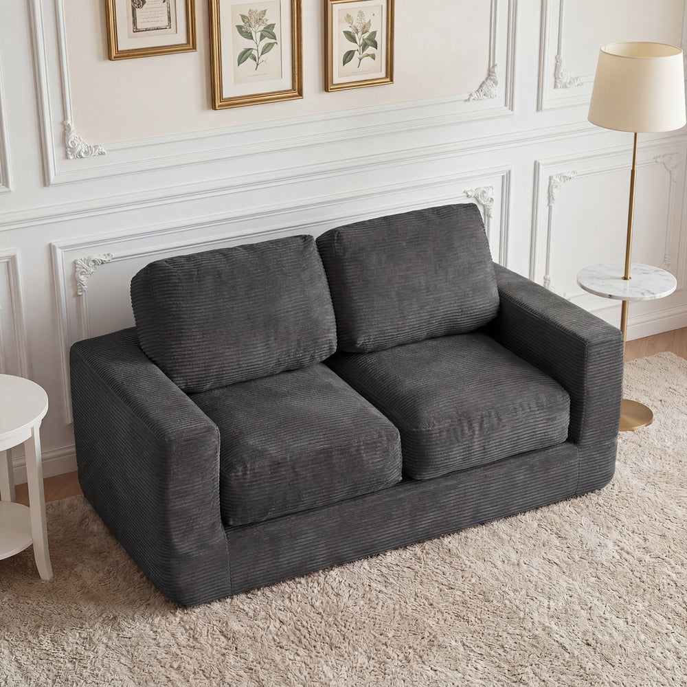 Black 2-seater floor couch loveseat with removable corduroy cover and supportive foam filling for cozy lounging.