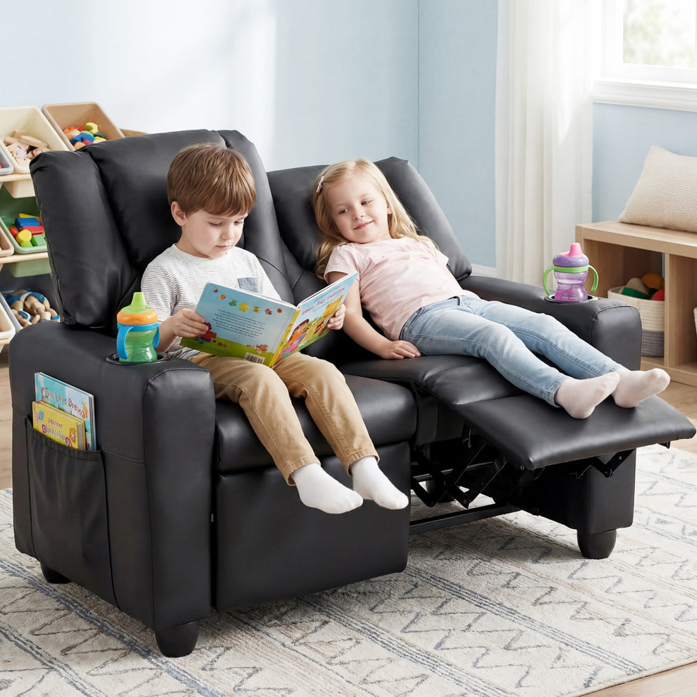 Kids enjoying a cozy moment on the black 2-seater recliner sofa chair with cup holders and adjustable backrest.