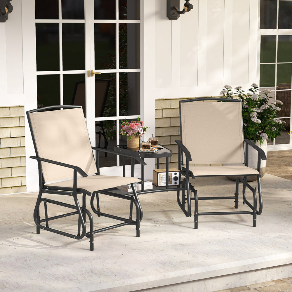 Two beige outdoor glider chairs with a center table, featuring breathable mesh fabric and a robust metal frame for comfort.