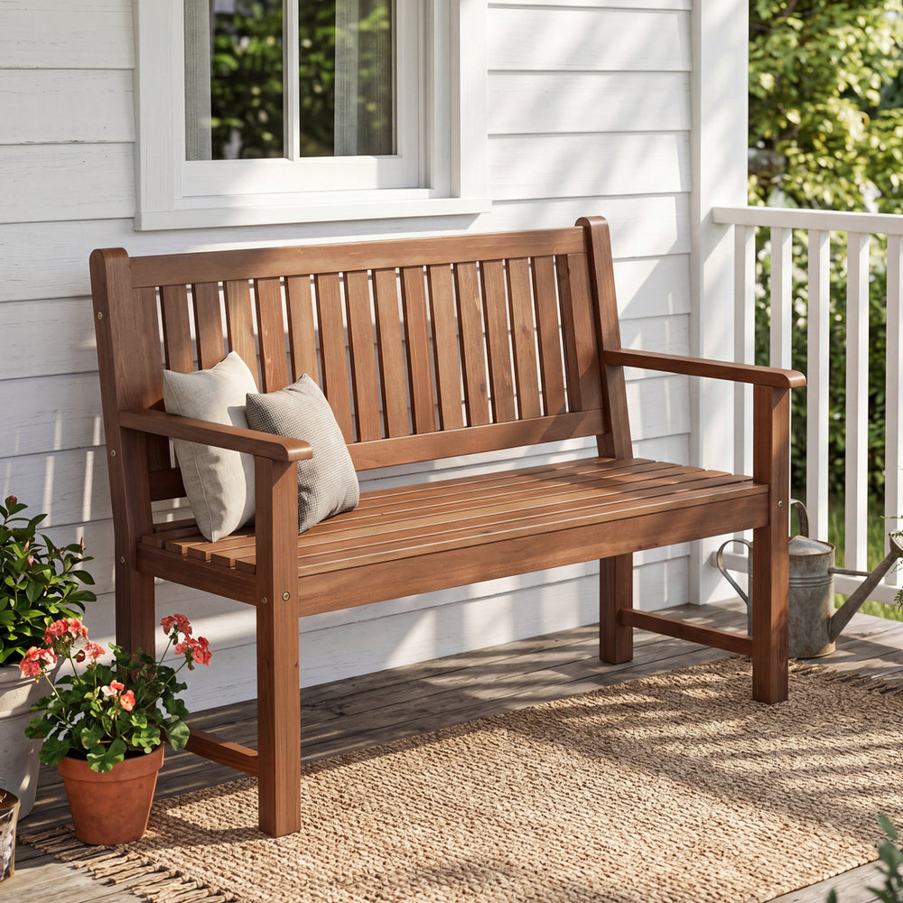 Brown 2-seater outdoor wooden bench with backrest and armrests, designed for comfort and stability in any space.