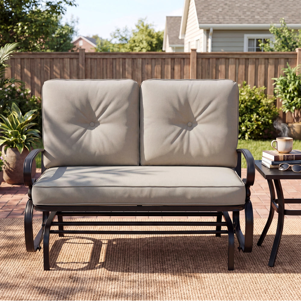 Outdoor swing glider chair with beige cushions, sturdy steel frame, and ergonomic design for comfortable relaxation.