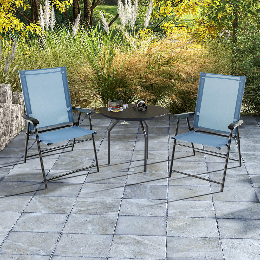 Two blue patio dining chairs with armrests and a metal frame, set on a stone patio, perfect for outdoor relaxation.