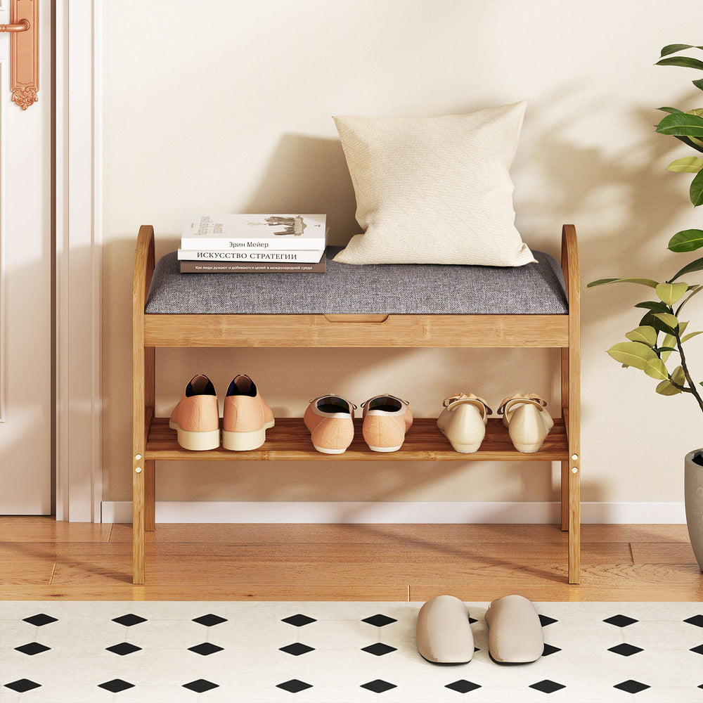2-tier bamboo shoe bench with gray padded cushion, featuring a slatted shelf for shoe storage, ideal for entryways.