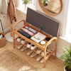 Bamboo shoe bench with gray padded cushion, featuring a spacious storage compartment and slatted shelf for shoes.