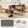 Bamboo shoe bench with gray padded cushion, featuring a slatted shelf for shoe storage, perfect for entryways.