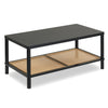 Boho coffee table showcasing a wide black tabletop and open rattan shelf, perfect for stylish living room storage.