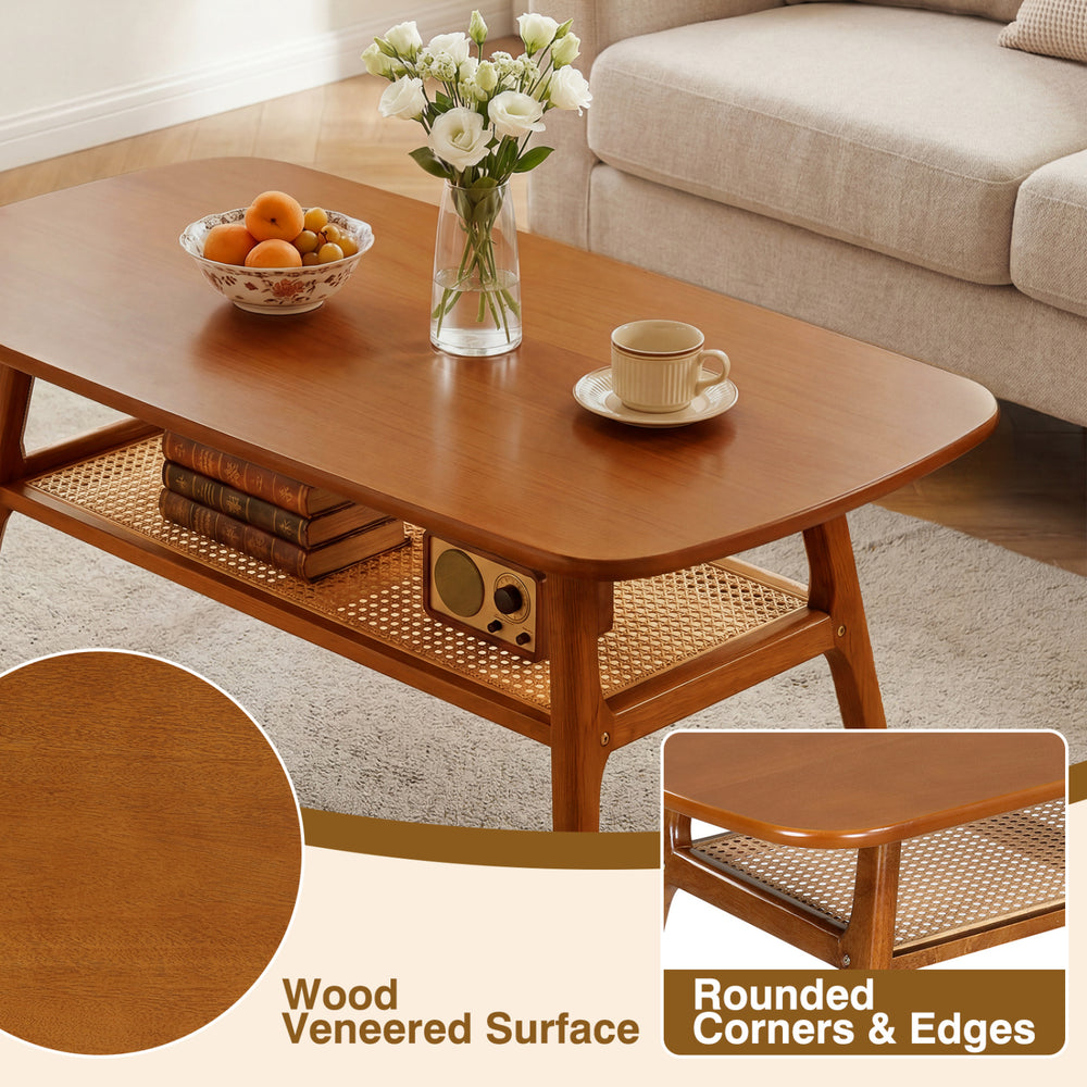 2-tier boho rattan coffee table with rounded corners, wood veneered surface, and open shelf for stylish living room use.