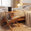 2-tier side table with teak wood frame, featuring a magazine rack and sturdy tabletop, perfect for bedroom or living.