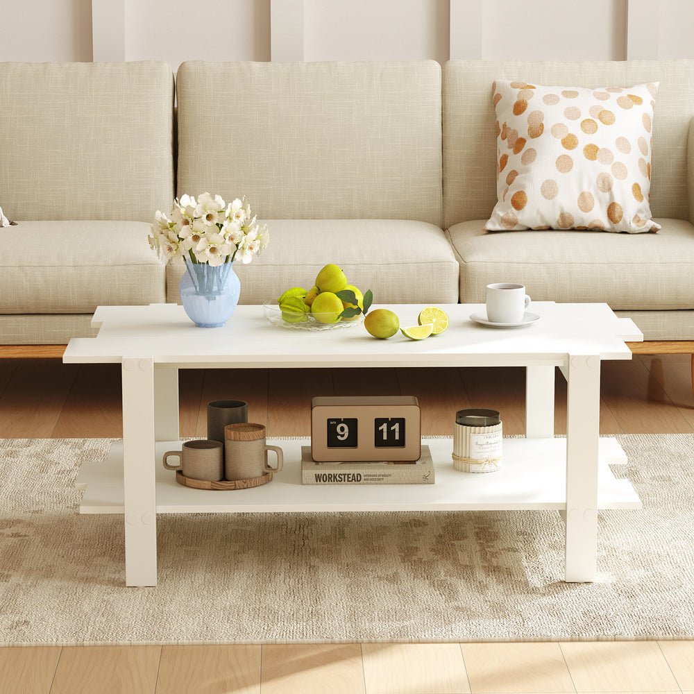 White 2-tier coffee table with slatted surface and storage shelf, perfect for living room decor and organization.