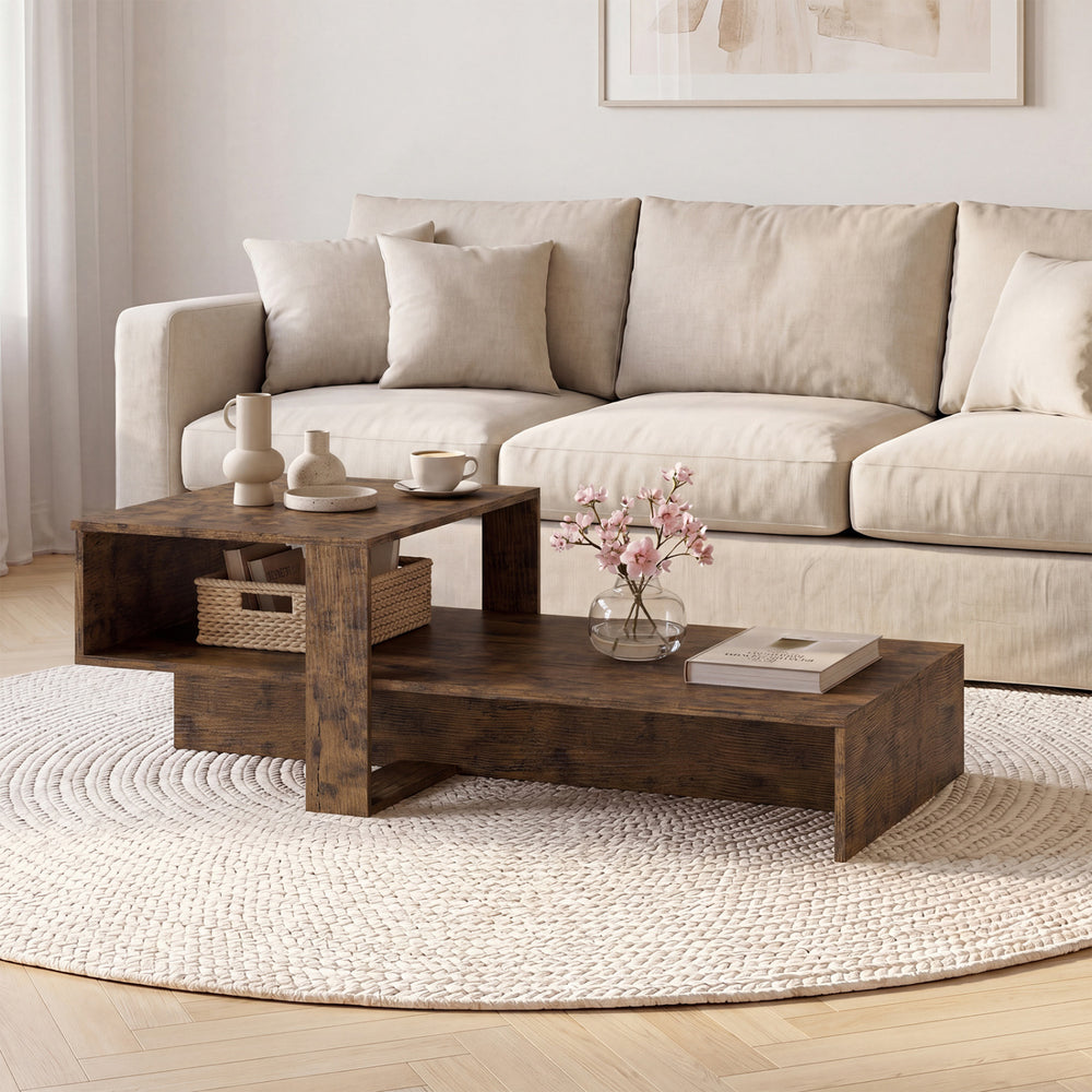Irregular 2-tier coffee table in brown with geometric design, offering stylish storage for decor and living essentials.