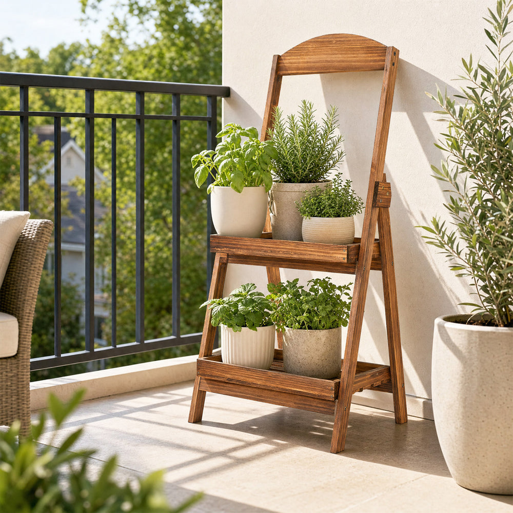 Rustic 2-tier ladder shelf made of carbonized fir wood, perfect for displaying plants on a balcony or in a living room.
