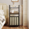 2-tier laundry hamper in black with tilt-out basket, perfect for organizing laundry in stylish bedroom decor.