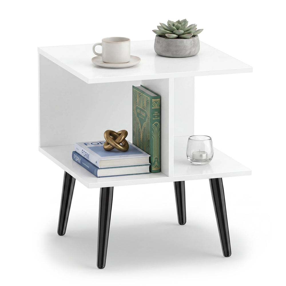 Square white end table with two compartments and raised metal legs, perfect for living room or bedroom decor.