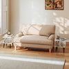 Mid-century modern white end table with two tiers and raised metal legs, perfect for living room or bedroom use.