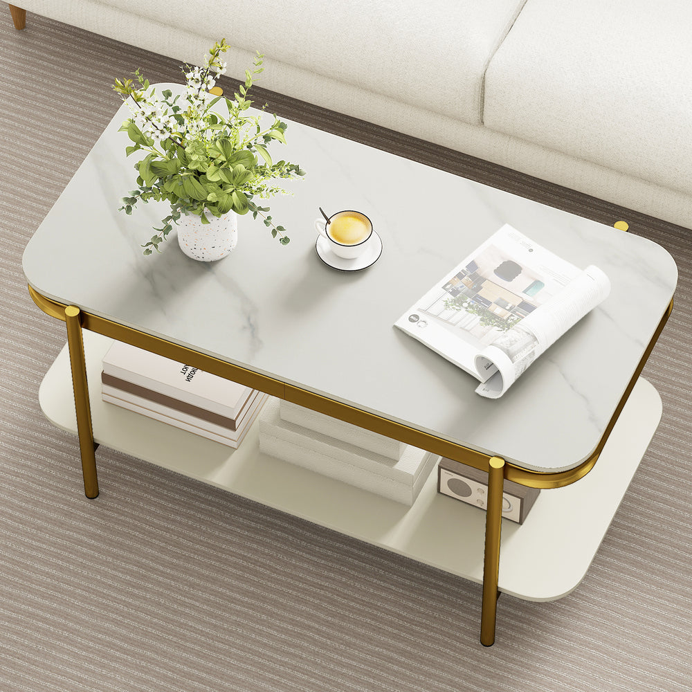 Modern rectangular coffee table with sintered stone top, gold metal frame, and open storage shelf for stylish living.