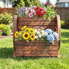 2-tier rustic wood garden bed in wagon shape with drainage holes, showcasing vibrant flowers for outdoor decor.