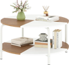 Round coffee table with a split-color tabletop, metal frame, and storage shelf for organizing daily items.