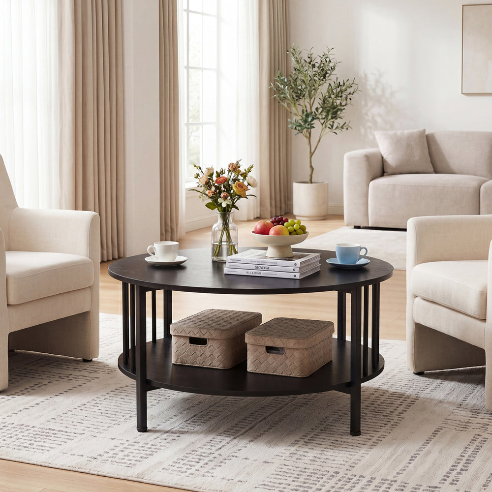 Round coffee table in black walnut with metal accents, featuring a 2-tier design and open shelf for storage.