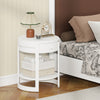 Round white end table with a drawer and lower shelf, featuring a sleek wood grain finish for rustic appeal.
