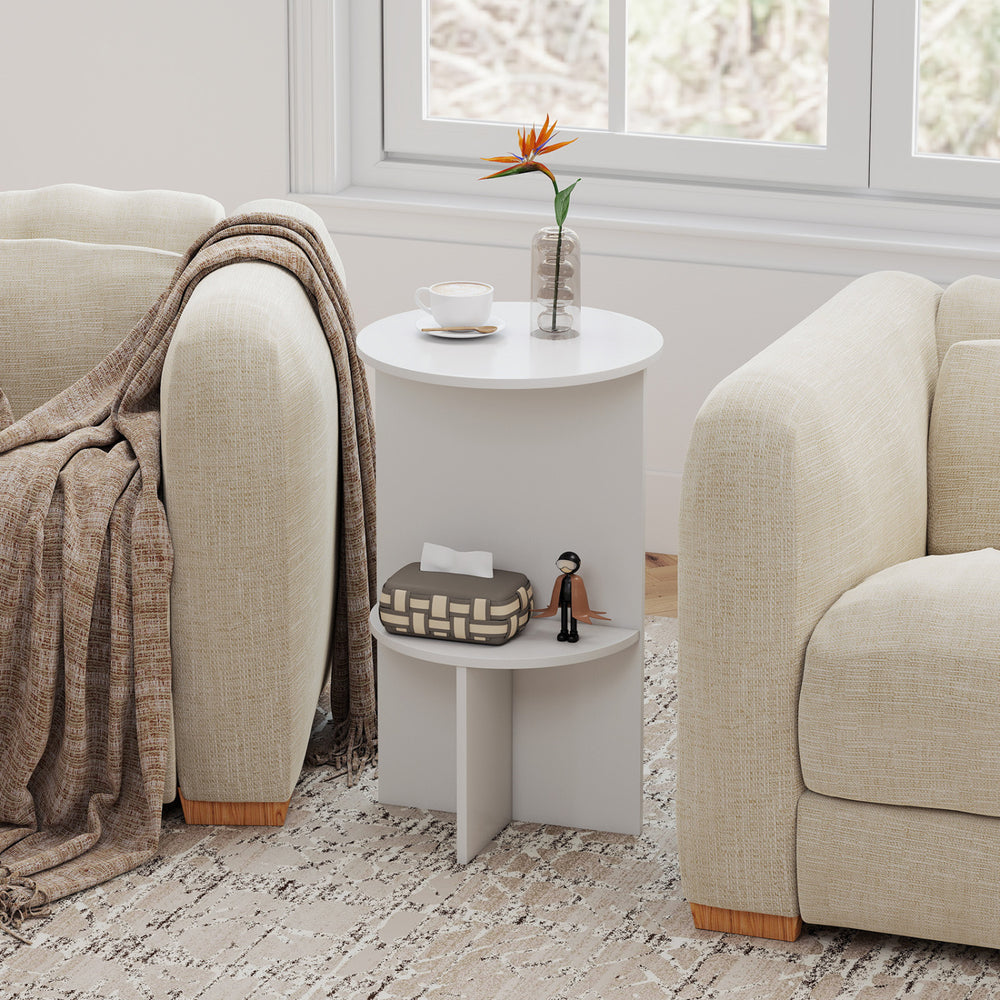Round side table in white with dual-layer storage shelf, perfect for small spaces in living rooms or bedrooms.