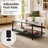 2-tier black coffee table with tempered glass top and adjustable foot pads for stability, perfect for modern living spaces.