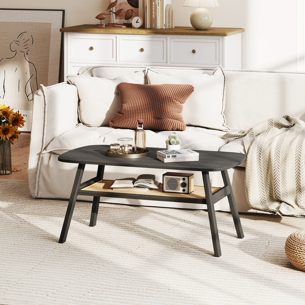 Rectangular coffee table in dark gray featuring a rattan shelf and sturdy rubber wood legs, enhancing any living space.
