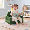 Convertible kids sofa in green with Christmas patterns, shown as a lounger for reading and relaxation.