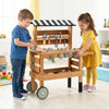 Kids playing with the 2-in-1 rolling cart featuring a workbench and construction tools for imaginative play.
