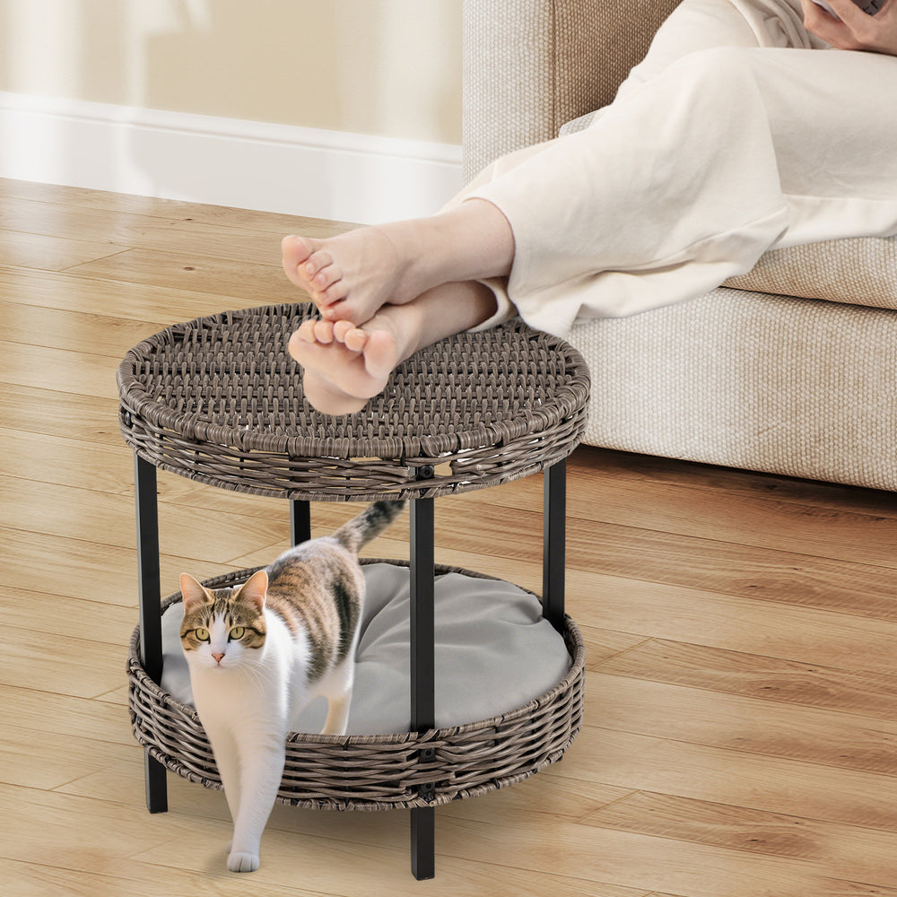 2-tier rattan cat nest with removable cushion, featuring elevated design for ventilation and dual use as an ottoman.