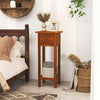 Slim brown nightstand with drawer and open shelf, made of acacia wood, perfect for bedroom or living room storage.