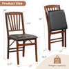 Folding chair with padded seat and rubber wood frame, featuring a slanted backrest for comfort and stability.