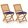 Set of 2 outdoor folding chairs made of acacia wood with navy seat cushions, ideal for dining and camping.