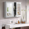 Close-up view of the double mirrored doors on the white 2-tier bathroom wall-mounted cabinet with metal handles.