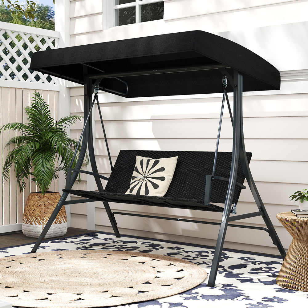 Three-person porch swing with adjustable black canopy and rattan seat, perfect for backyard relaxation.