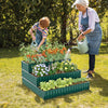 Three-tier green metal raised garden bed planter box with various plants, ideal for vegetables and flowers in outdoor.