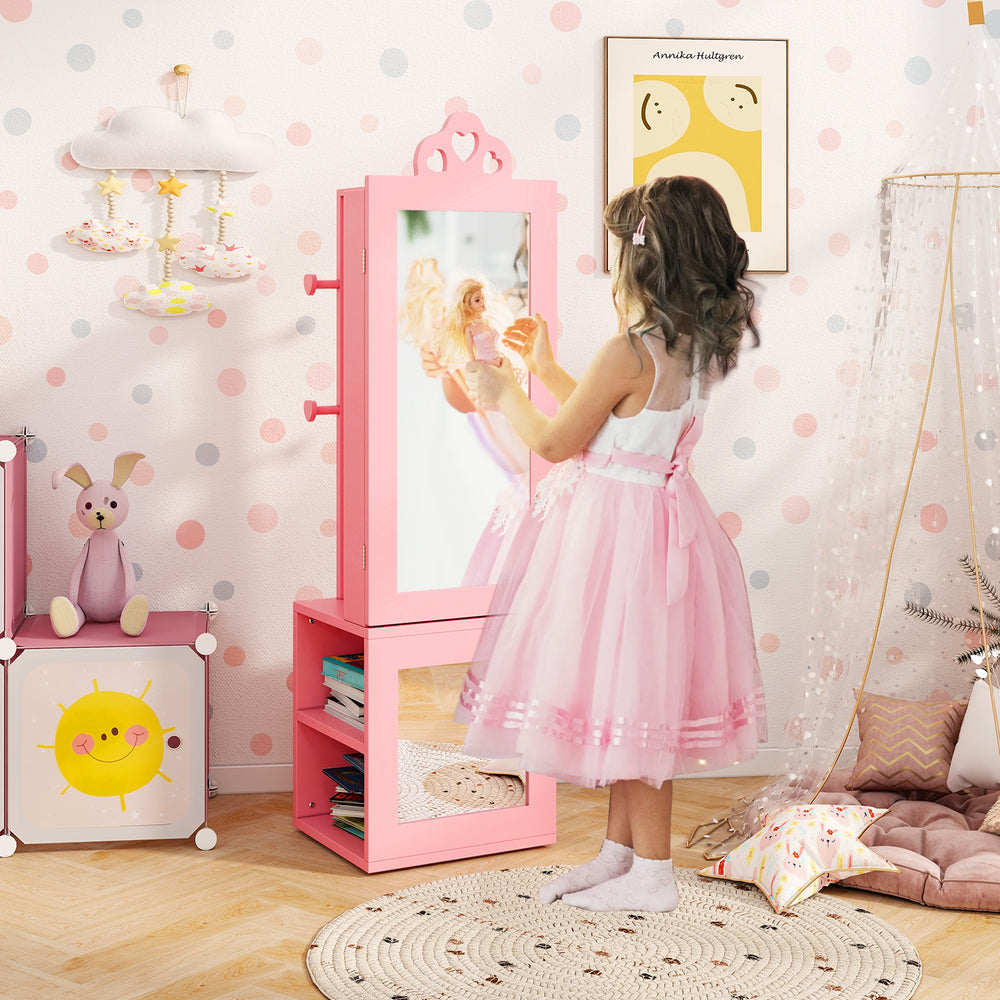 Freestanding pink kids jewelry cabinet with full-length mirror, featuring heart-shaped cutouts and ample storage for.