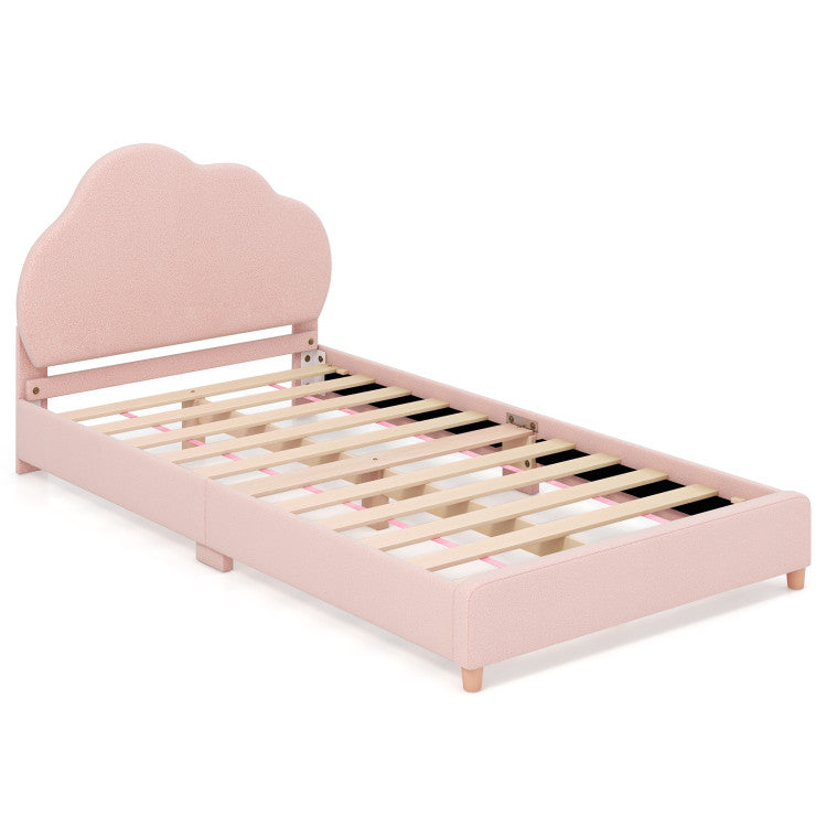 Twin bed frame with cloud-shaped headboard in pink velvet, designed for kids' safety and comfort in bedrooms or.