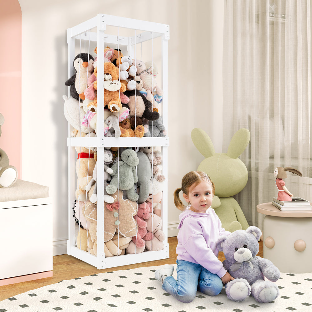 Large stuffed animal storage in white with open top and elastic cords, perfect for organizing kids' toys in playrooms.