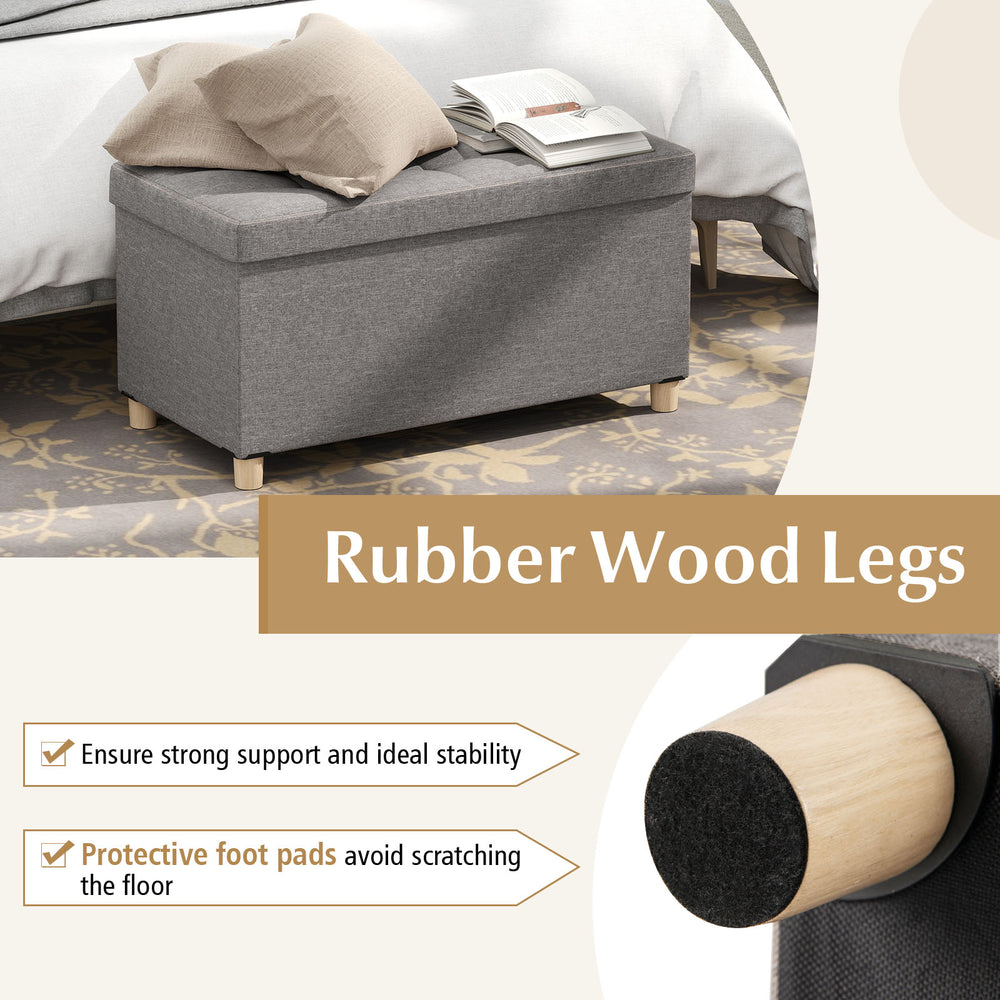 Detail view of the rubber wood legs and protective foot pads of the gray 30-inch storage ottoman bench, ensuring floor.