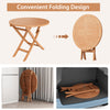 Round 31.5-inch folding coffee table made of teak wood, showcasing its space-saving design for outdoor use.