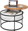 Round lift top coffee table in teak with hidden compartment and side shelves, ideal for organizing small items.