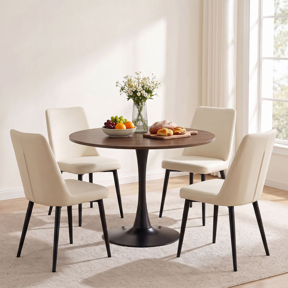 Round 31.5-inch walnut tulip table with metal pedestal, perfect for small dining spaces and easy to clean.