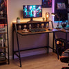 Close-up of the rustic brown surface of the 31.5" industrial desk, highlighting the metal frame and raised shelf for.