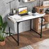 32-inch white computer desk with built-in charging station and extra storage bag, ideal for home office use.