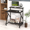 Rolling computer desk with ergonomic monitor shelf, black finish, power outlets, and compact design for small spaces.