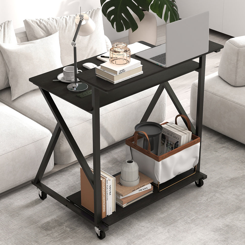Rolling black computer desk with ergonomic monitor shelf, power outlets, and storage, perfect for small spaces.