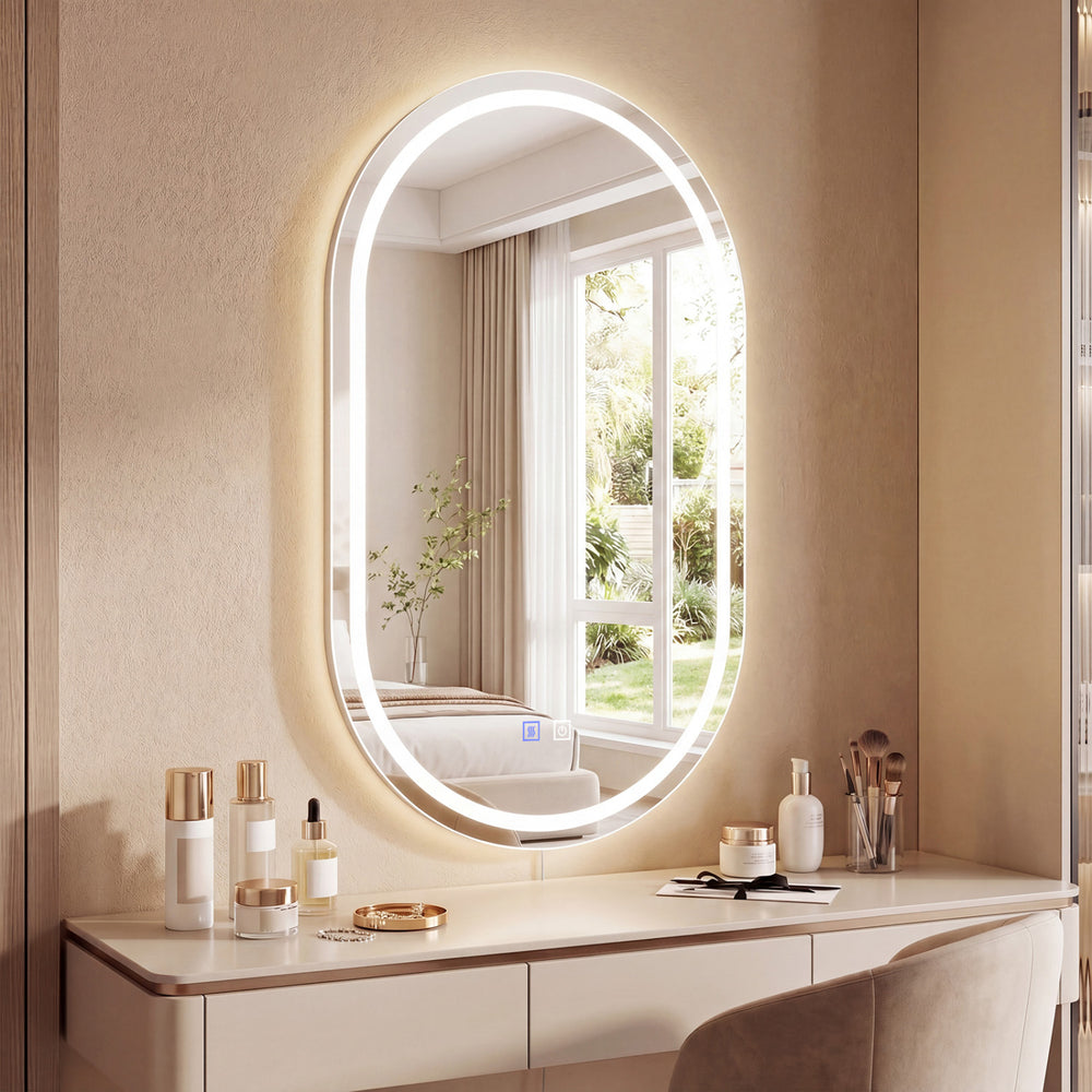 32x20" oval LED bathroom mirror with a sleek silver finish, offering a stylish design and efficient lighting for modern spaces.