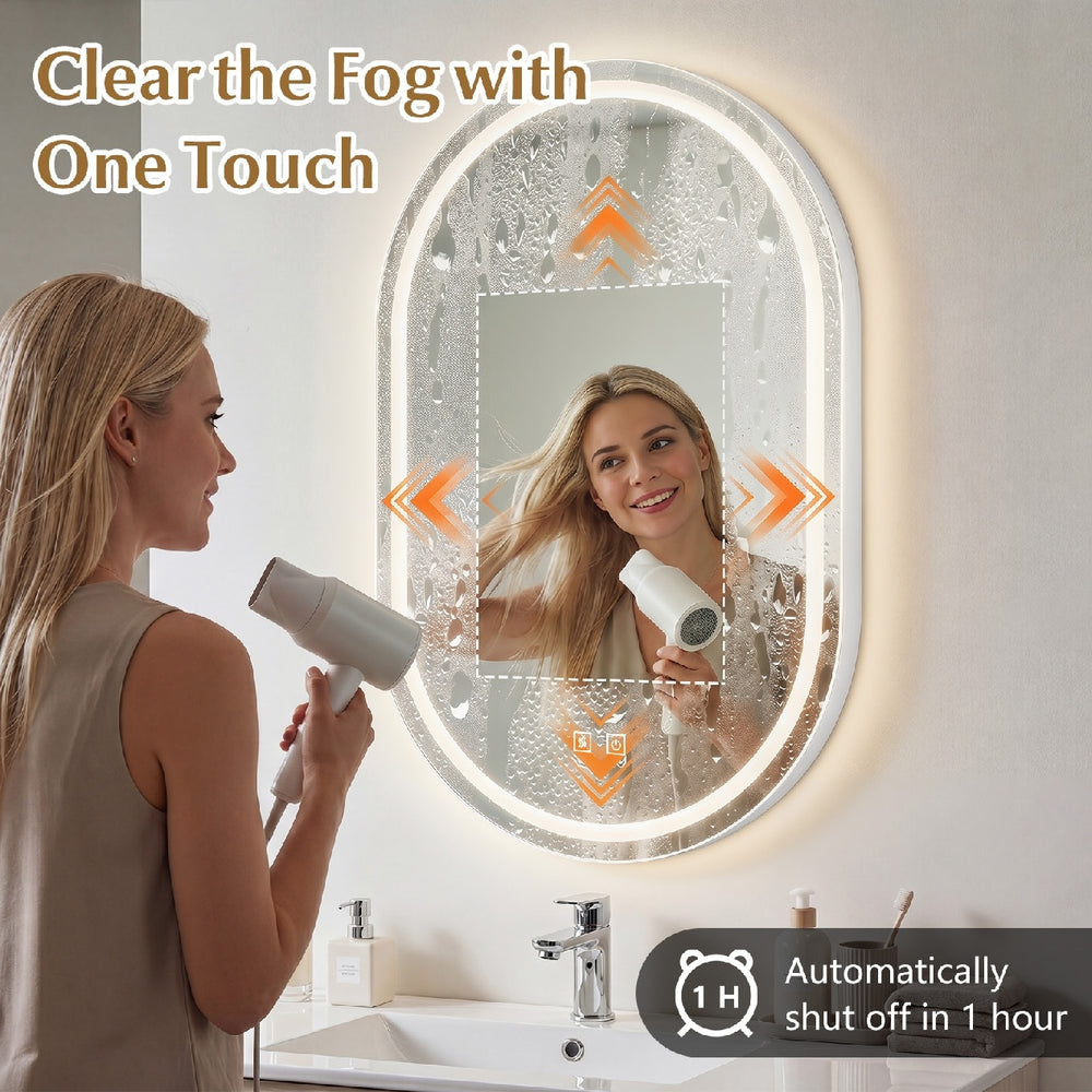 Oval 32x20" LED bathroom mirror features touch control, three light colors, and fog-free function for easy use.