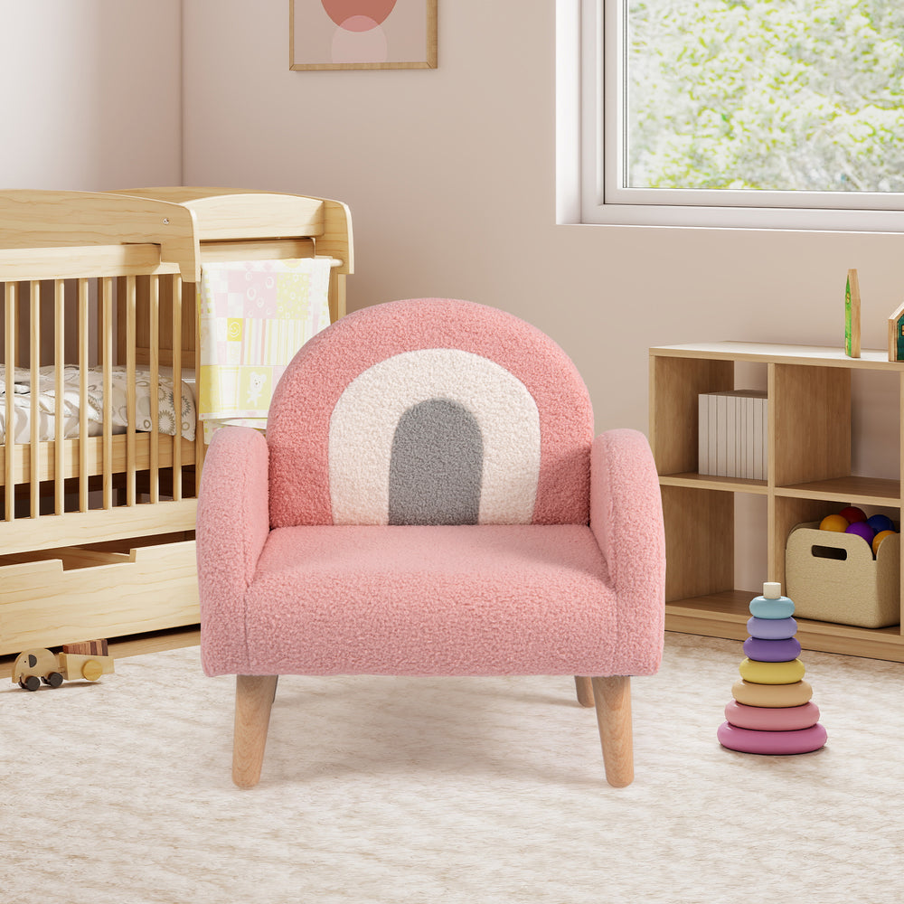 Kids armchair in pink teddy fleece with ergonomic backrest and armrests, perfect for nurseries and playrooms.